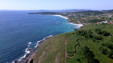 aerial drone footage stunning sea cliff and beach scenery with resort and forest