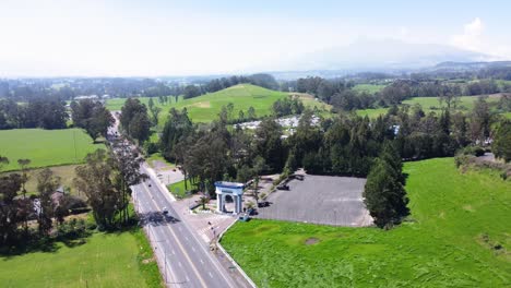 Aerial-over-road-network,-cars-driving,-rural-landscape-of-Ecuador