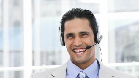Selfassured-businessman-using-a-headset