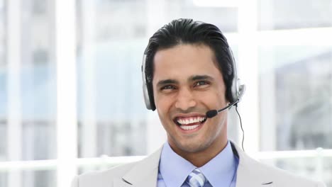 selfassured businessman using a headset