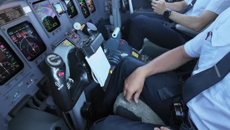 left view inside a jet cockpit of a pilot using the hand microphone to address the passengers. 4k 60fps