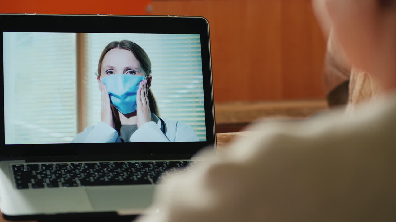 Senior Adult Woman Consults Family Doctor Via Video Link Holds Tablet 1