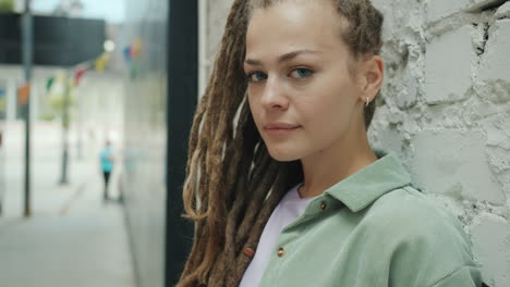 woman with dreadlocks in urban setting