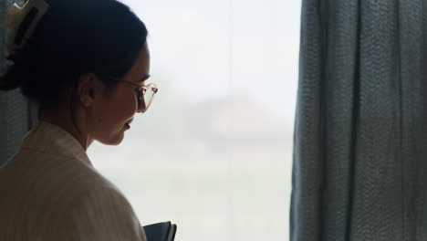 Silhouette-of-Woman-Seeking-Inspiration-by-Window