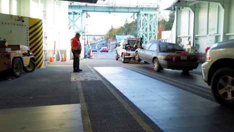 vehicles boarding a ferry