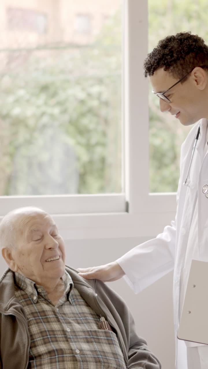 Doctor talking with a senior man in the nursing home