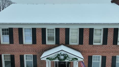 Aerial-rising-shot-of-a-large-brick-mansion