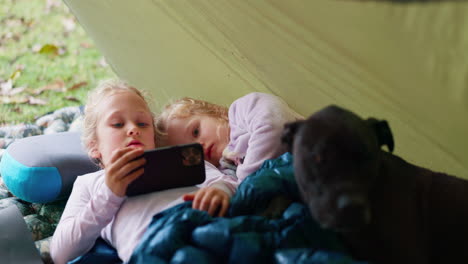 camping, children and phone for movies in nature