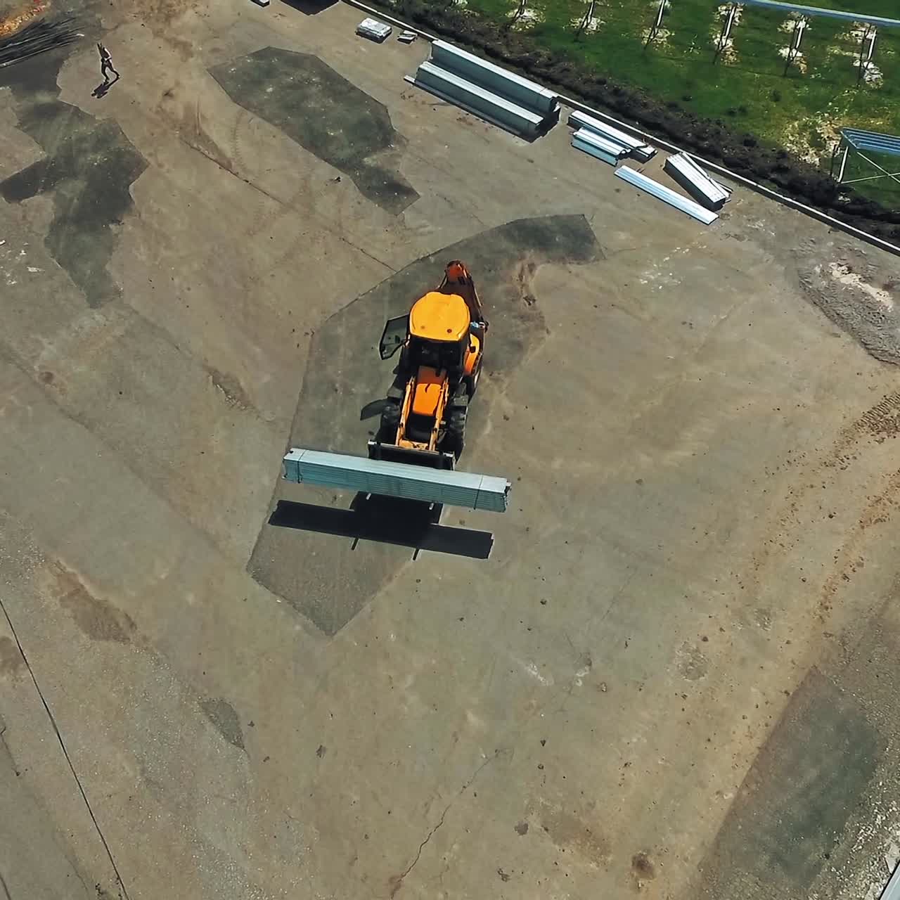 Industrial machine in a working yard in the summer. Technical equipment carrying instruments for building solar power plant. Top view.