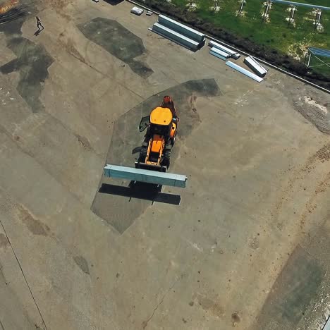 industrial machine in a working yard in the summer. technical equipment carrying instruments for building solar power plant. top view.