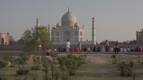 tourists look at taj mahal at sunset at agra, agravanam, yamuna river, uttar pradesh, india