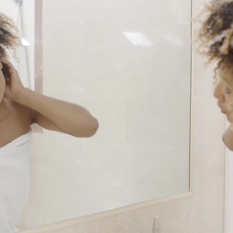 woman viewing herself in the mirror