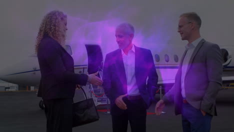 video of business colleagues shaking hands outside airplane and purple abstract light