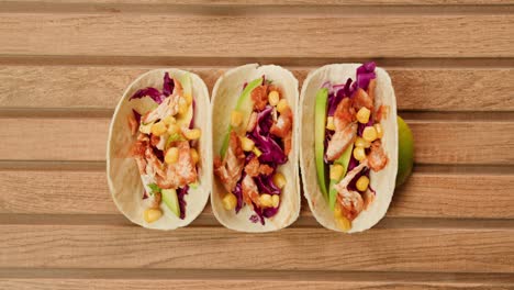 chicken tacos on a wooden board