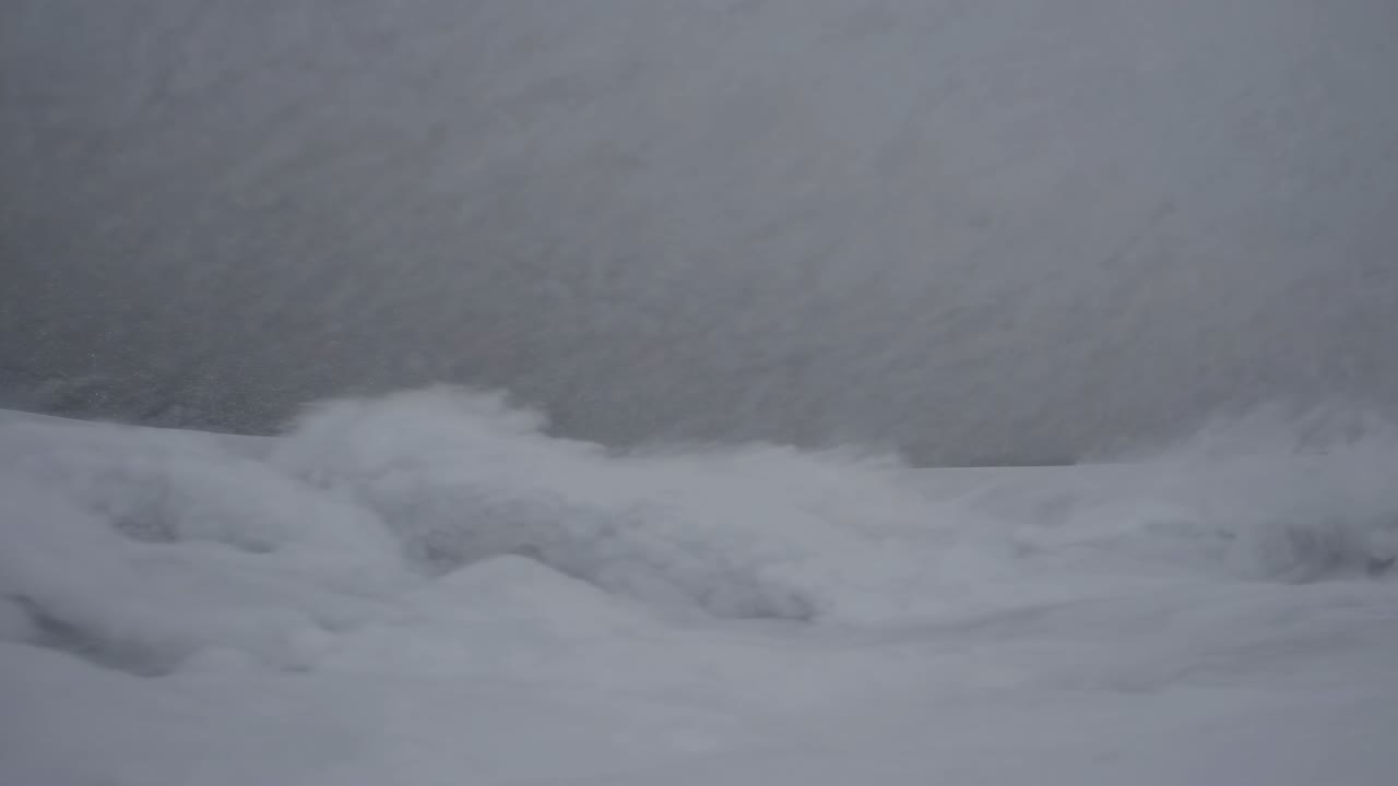 Abstract video still of a snowy landscape, captured from a low angle