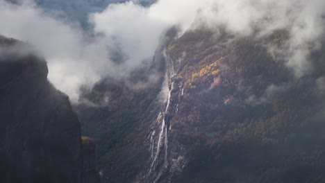 heavy white clouds whirling above the geiranger fjord