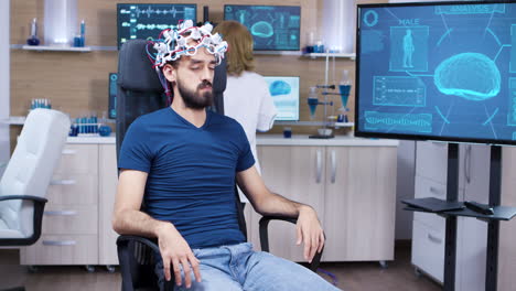 patient with brainwaves scanning headset closing his eyes