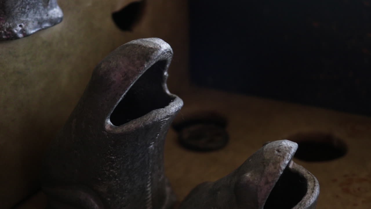 Close-up of Vintage Metal Frog Statues