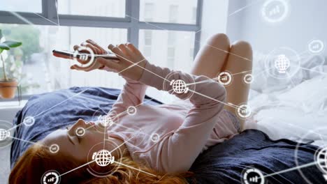 animación de una red de conexiones con iconos sobre una mujer caucásica usando un teléfono inteligente