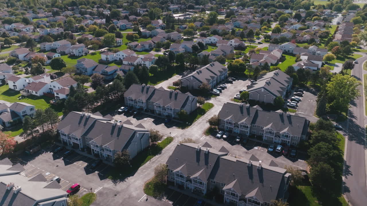 Orbiting drone shot of apartment neighborhood in the suburbs