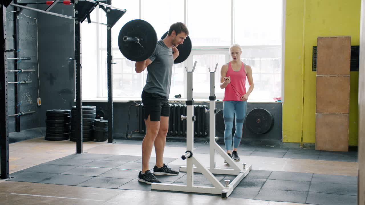 Man Weightlifting with Personal Trainer