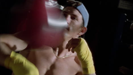 a boxer practices his punches on a speed bag 1