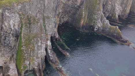 dramatic cliffs in county cork, ireland, with ocean view, peaceful mood