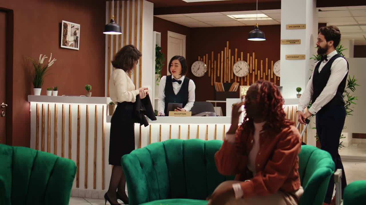 Hotel visitor writes signature on tablet