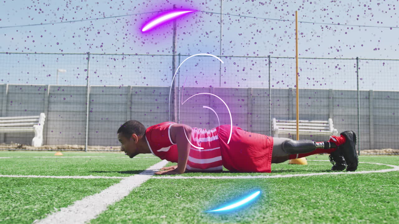 male athlete doing push-up on turf, showing prosthetic leg with neon overlays for sports training