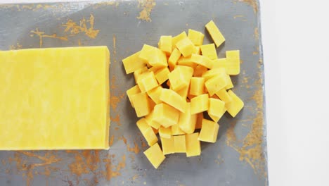 Yellow-cheese-cubes-on-tray