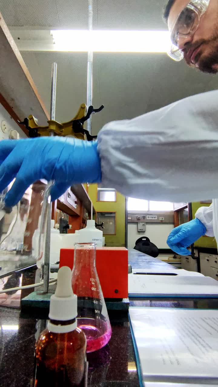 Scientist doing titration to calculate the concentration of an acid