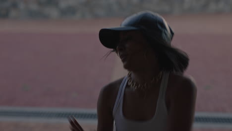 dancing-woman-young-hip-hop-dancer-in-city-enjoying-fresh-urban-freestyle-dance-moves-practicing-expression-at-sunset-close-up