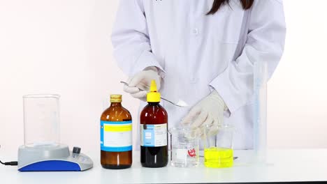 scientist performing iodine clock reaction experiment in laboratory setting