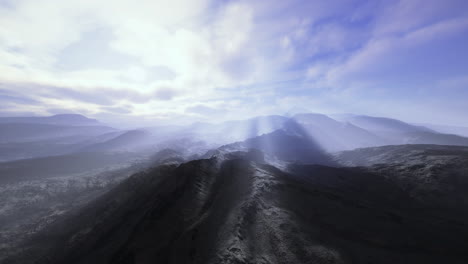 majestic mountain landscape under soft morning light with layered shadows
