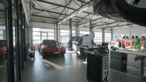 cars undergoing maintenance in auto repair shop