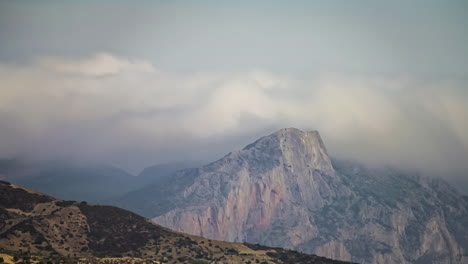 time lapse of atlas moroccan mountains being enveloped by a dense cloud cover