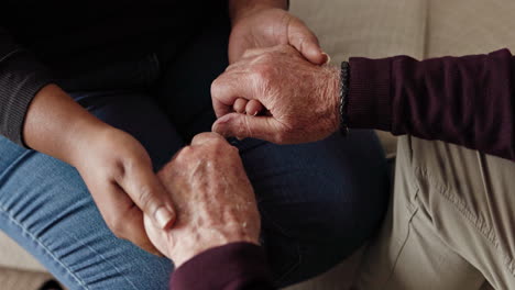 two people holding hands in a sign of support and tenderness