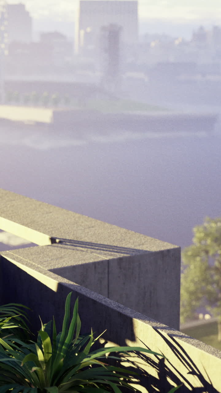 Scenic urban balcony view with greenery overlooking a river and city skyline