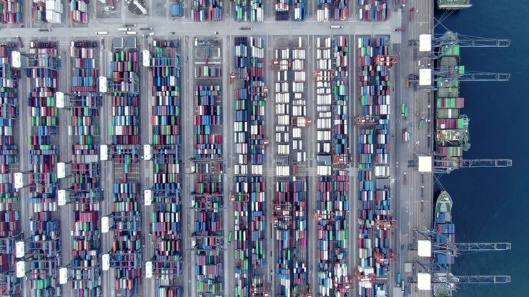 Mega Container Ship docked at Hong Kong port, during loading and unloading operation, Aerial view