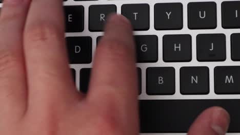 pressing keys on a laptop keyboard - close up