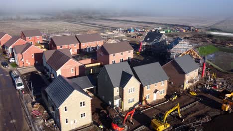 aerial view new housing estate being built and developed in british countryside