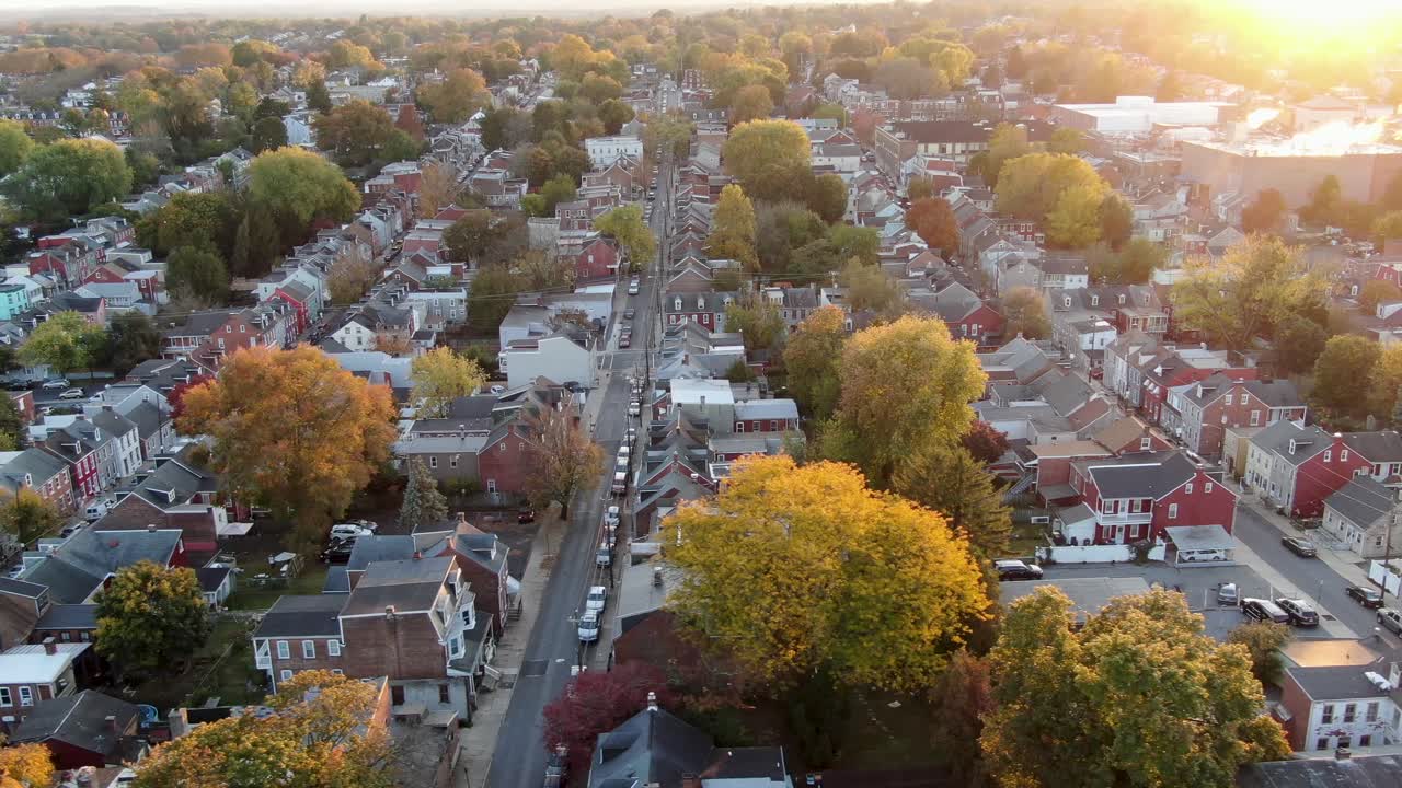 Urban city aerial truck shot during sunrise in autumn, rowhomes, city view in United States, peaceful America, patriotism concept