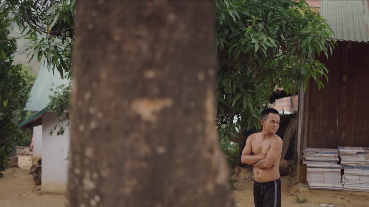 Man standing outdoors in a rural setting