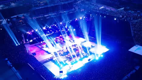 aerial view of a concert with a large crowd and a stage with lights