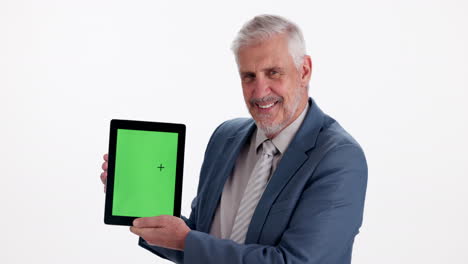 senior man holding tablet with green screen
