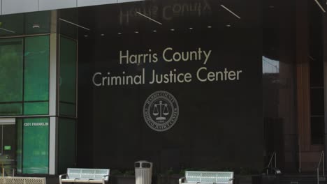 establishing shot of the harris county criminal justice center in houston, texas