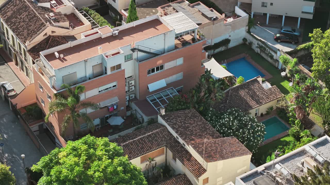 Condo building residential real estate holiday destination swimming pool, aerial drone