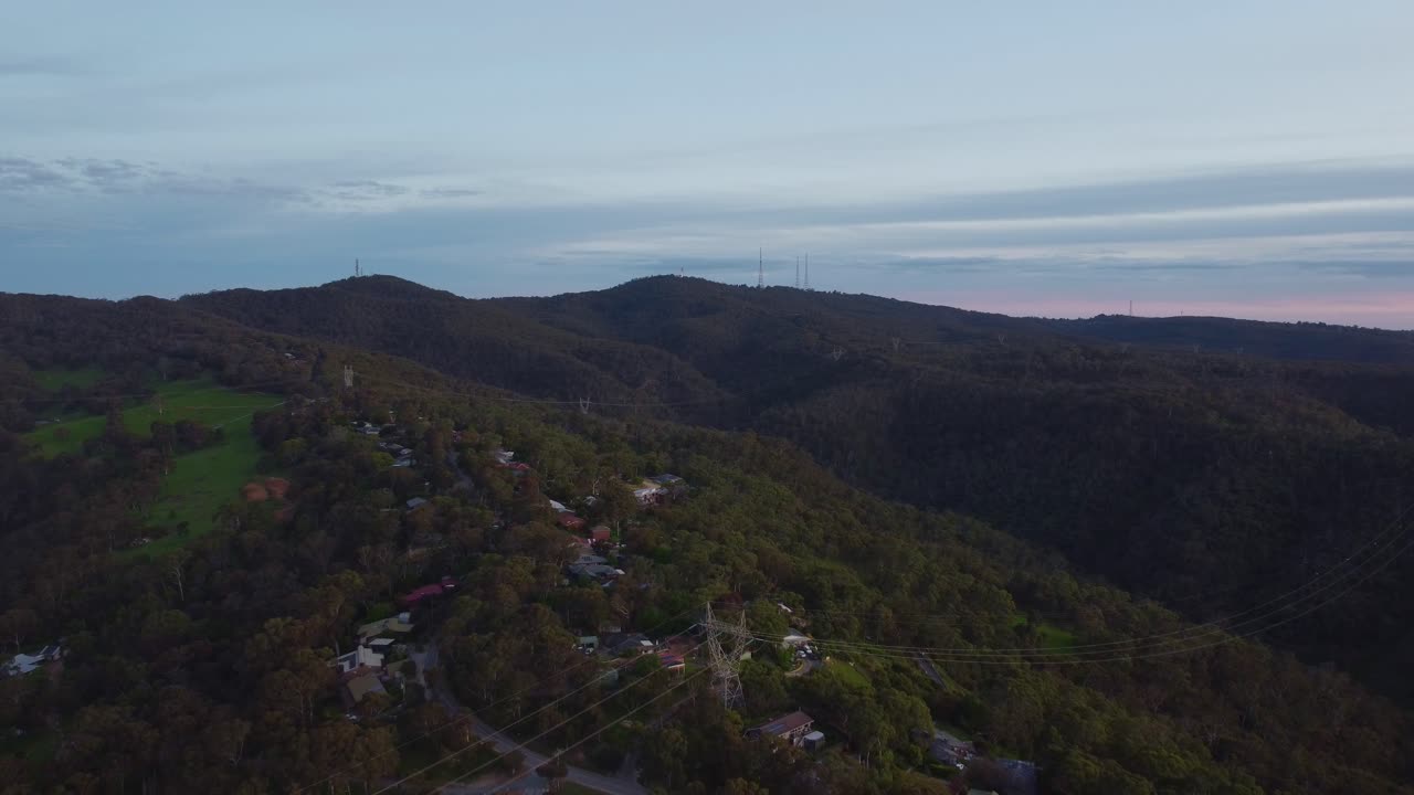 Long shot of Mt lofty slowly moving towards it with surrounding rolling hills and suburbs centred on Mt lofty's tower - the flinders column