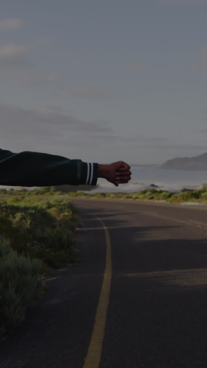 Animation of biracial woman walking on road, trying to hitch-hiking