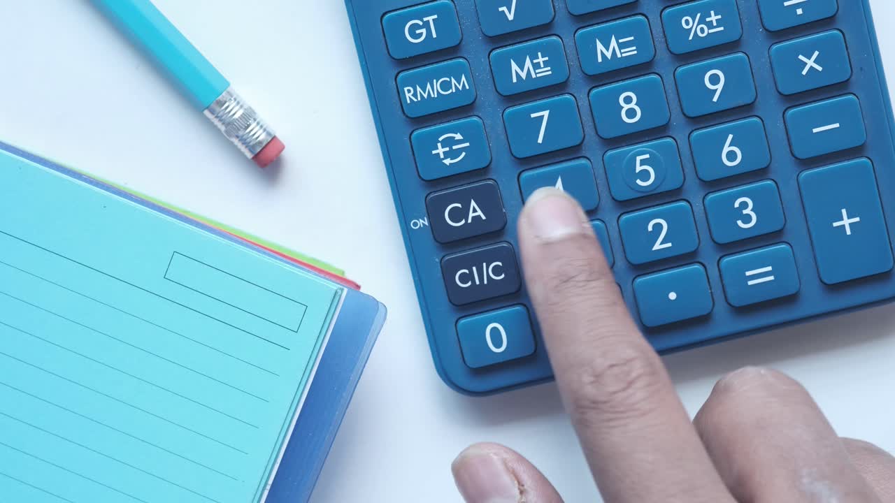 Calculator with Notebook and Pencil